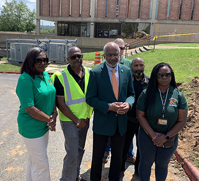 Robinson discusses recovery efforts standing with (from left) Senior VP Finance and Administration W. Rebecca Brown, Associate Vice President Facilities, Planning, Construction, and Safety Kendall Jones, Emergency Management Director Ashley Davis, Interim Police Chief Sgt. John Cotton and Emergency Management Deputy Director Ivy Baker