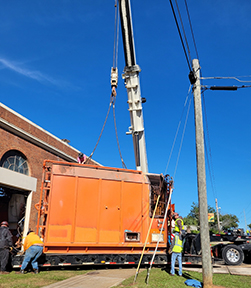 Crews remove the boiler from the Central Plant. (Credit Facilities Planning, Construction and Safety)