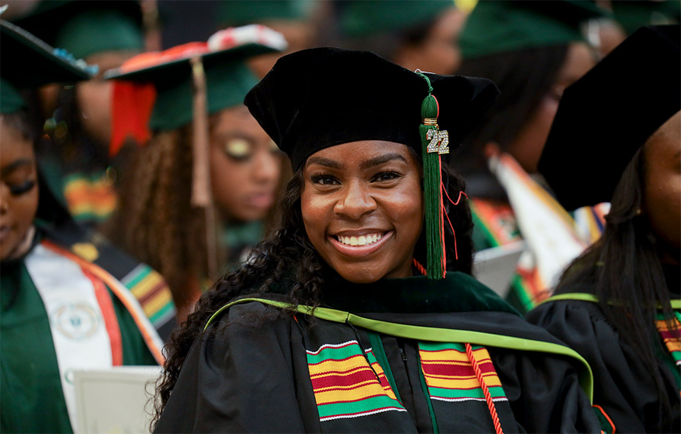 Student smiling at graduation. 