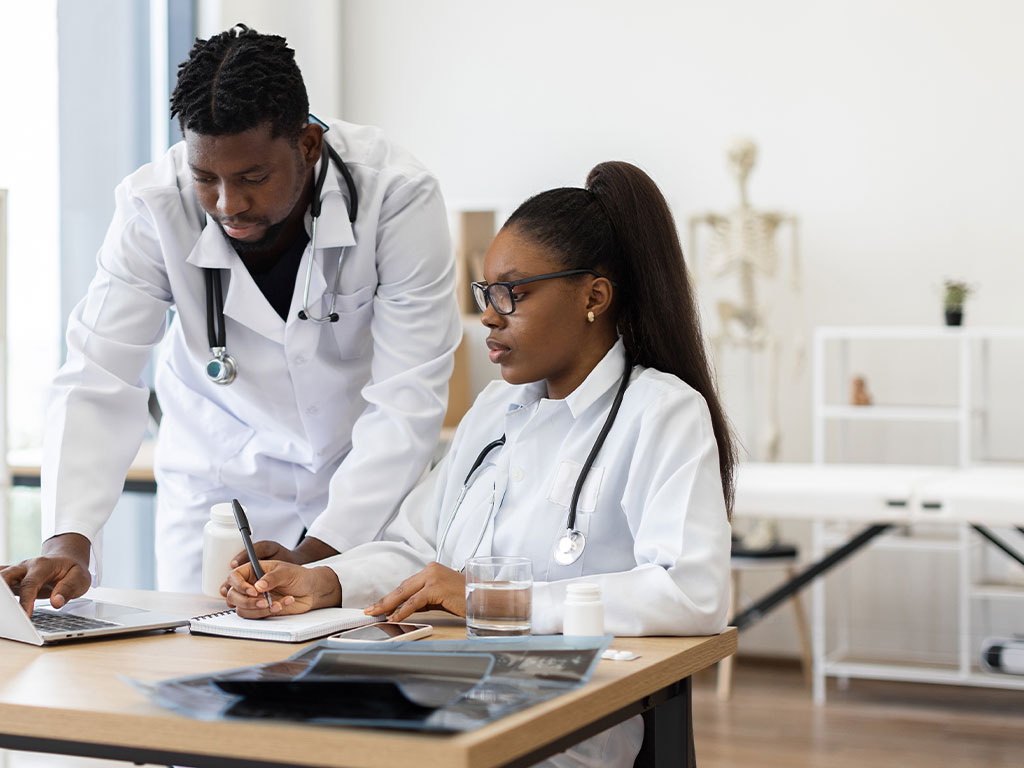Two public health professionals in office
