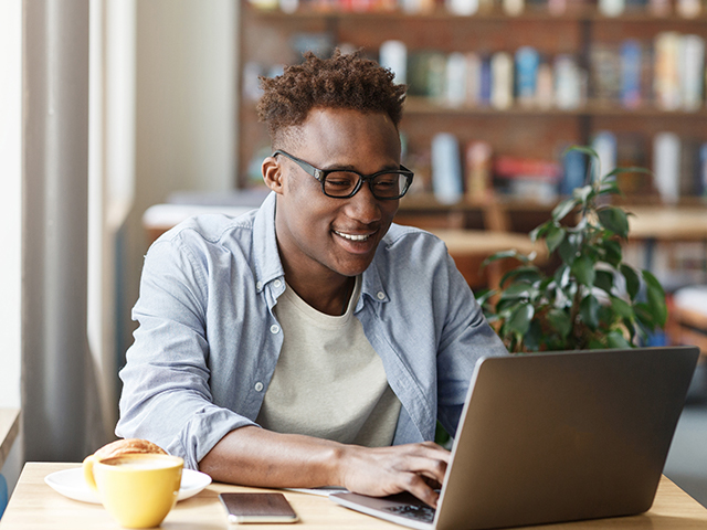 Young african american man using a laptop