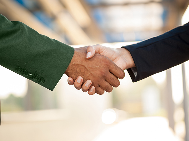 Close up of a handshake between two people