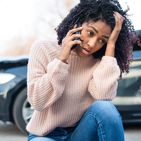 girl using cell phone visibly upset