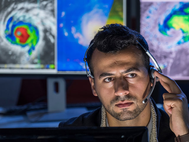 Meteorologist analyzing weather patterns