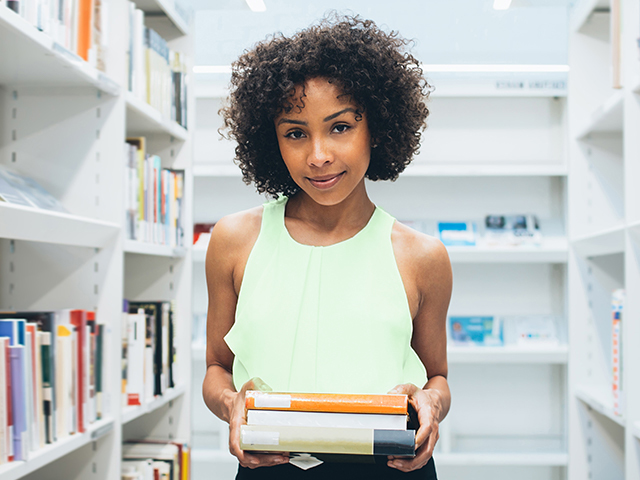 Textbook Returns (Law School) Girl in bookstore holding books