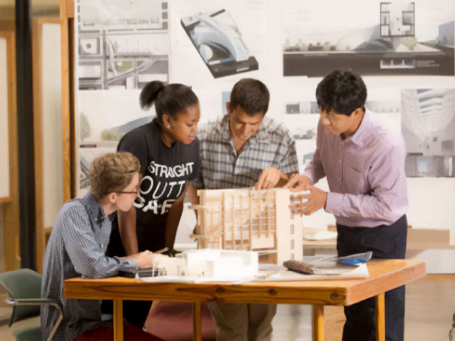 Archtitecture students working on scale model of building