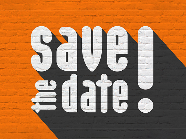 "Save the date" sign displayed prominently on a vibrant orange brick wall, creating a striking visual announcement.