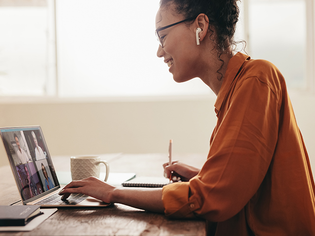 Woman watching a video on laptop