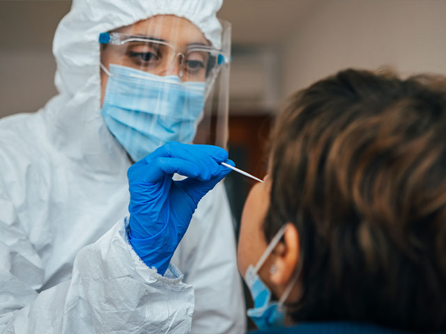 Health worker giving covid test