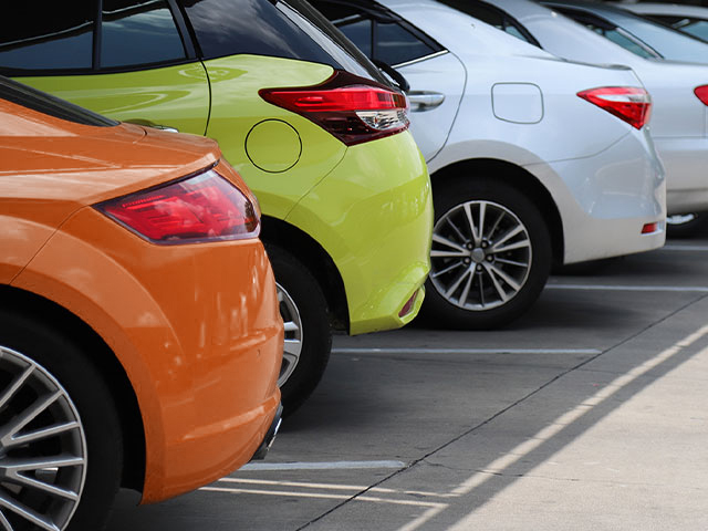 Cars lined up in a parking lot