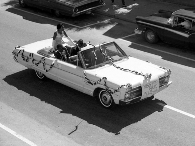 Float in the FAMU homecoming parade. The Sign at front of car reads, "Miss Pre-Med. 1965-66"