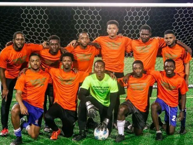 Students playing soccer