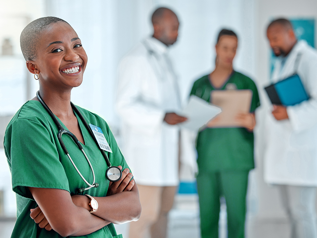 Smiling woman health worker with crossed arms